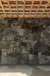 Photo of stone wall in carport